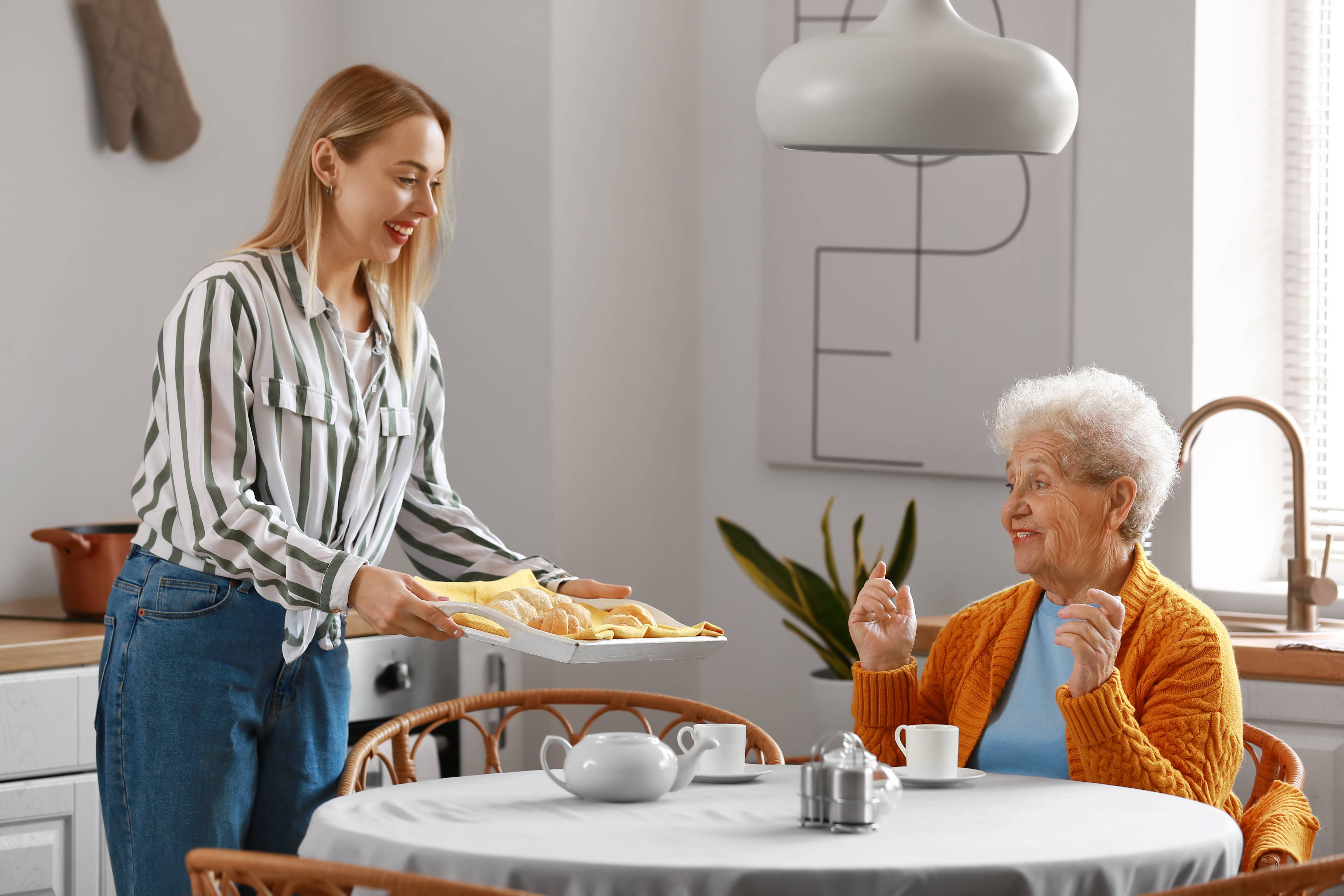 Young woman with baked croissants