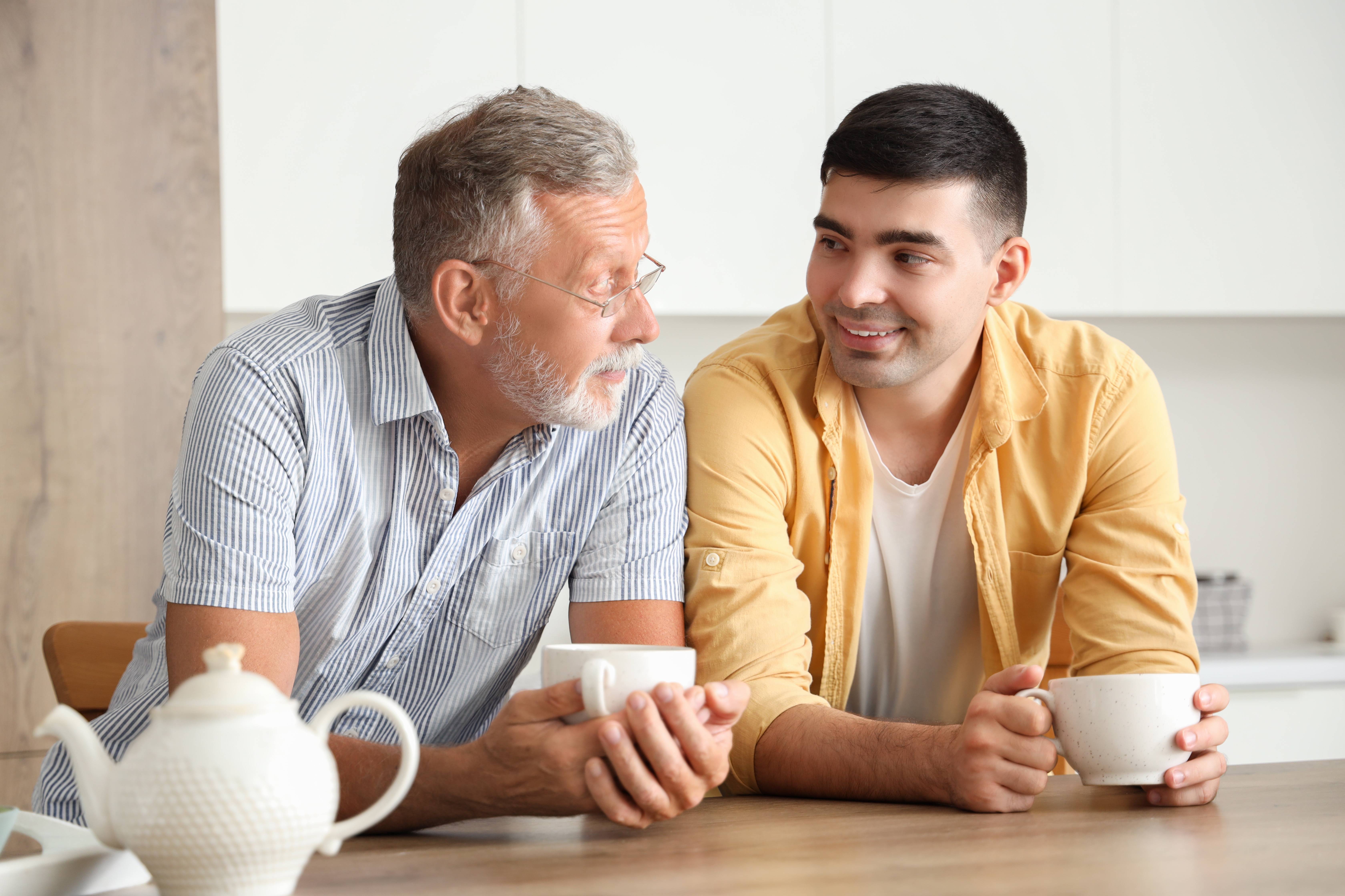 Senior man with his son drinking tea